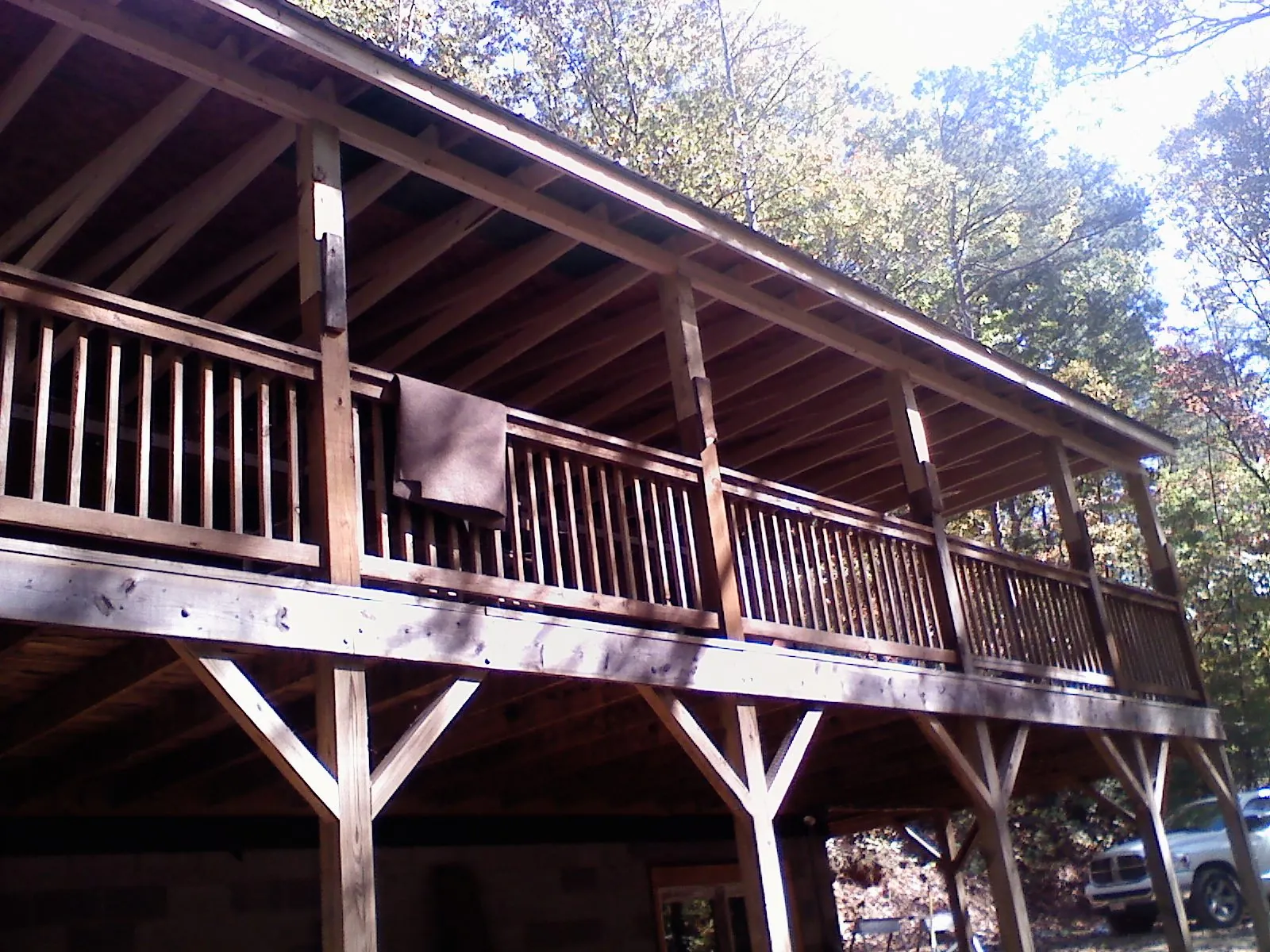 Timber framing under a new elevated porch and deck — Roof Leak Repair in Waupaca by Roofing Brothers